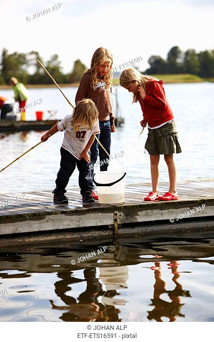Children on a jetty, Sweden