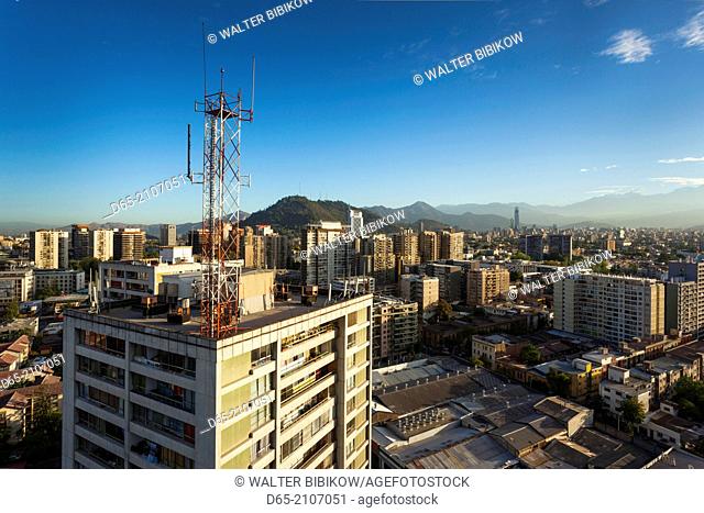Chile, Santiago, elevated city view towards the Gran Torre Santiago tower, dawn