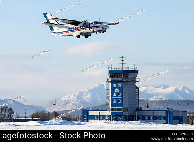 RUSSIA, KAMCHATKA REGION - FEBRUARY 9, 2023: A Let L-410 Turbolet transport aircraft of Kamchatka Air Enterprise flies over Petropavlovsk-Kamchatsky...
