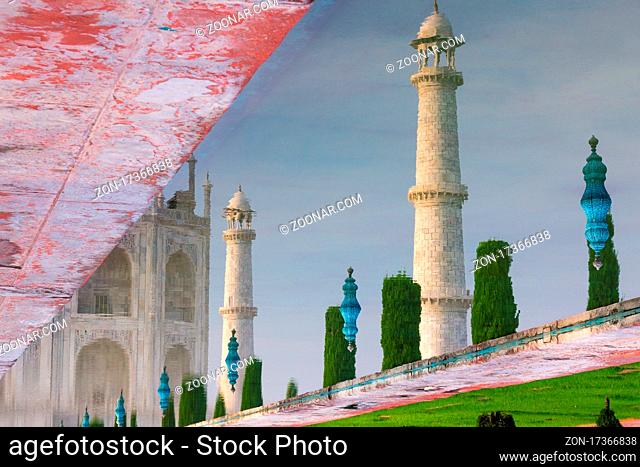 Reflection of the Taj Mahal's minarets photographed in August. This famous mausoleum has been built for Mumtaz Mahal by her husband Shah Jahan