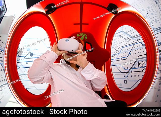 RUSSIA, MOSCOW - NOVEMBER 19, 2023: A child uses a VR headset to have a tour of Prospekt Lavrentyeva Street n the scientific research town of Akademgorodok at a...