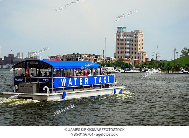 A water taxi takes passengers across the harbor in Baltimore, Maryland
