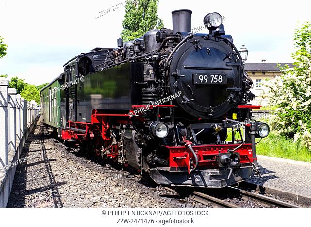 Steam train on the Zittau Railway, Saxony , Germany. A narrow gauge steam railway serving the mountain spa resorts of Oybin and Jonsdorf in the Zittau Mountains...