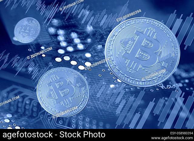 Economy trends virtual digital currency and financial investment trade concept. Bitcoin cryptocurrency, money, stock market trading graph and circuit board...