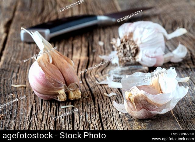 Ripe garlic head on wooden table