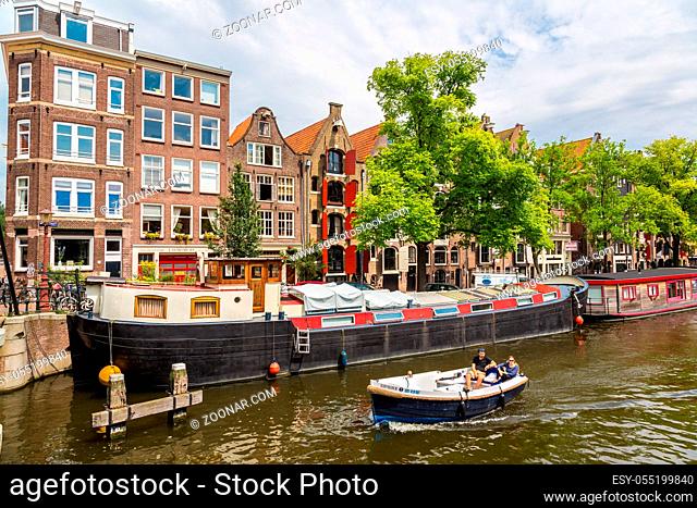 AMSTERDAM, NETHERLANDS - AUGUST 19: Canals of Amsterdam. Amsterdam is the capital and most populous city of the Netherlands on August 19, 2014