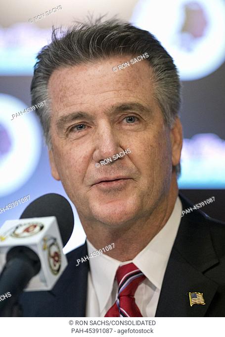 Washington Redskins general manager Bruce Allen meets reporters informally following the press conference where Jay Gruden was introduced as the new head coach...