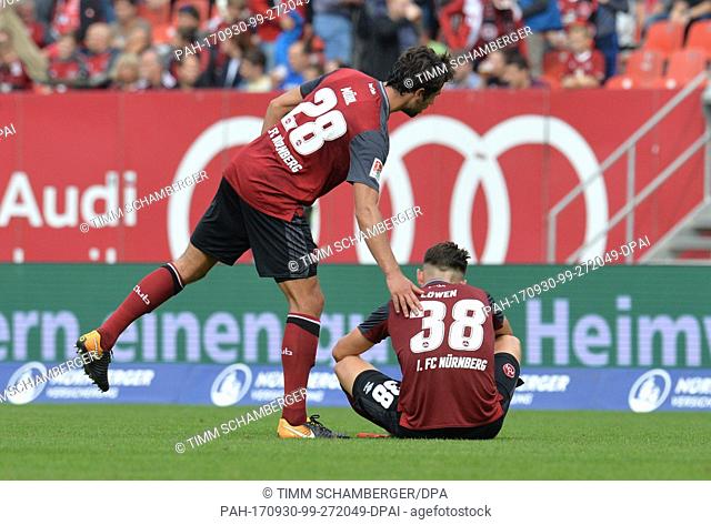 Nuremberg's Lukas Muehl (L) and Eduard Loewen are disappointed after the German 2nd Bundesliga match between 1st FC Nuremberg and Arminia Bielefeld in Nuremberg