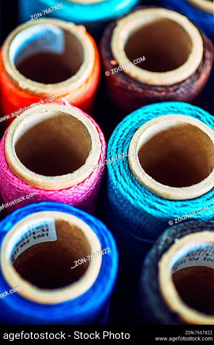 Sewing threads multicolored background closeup texture