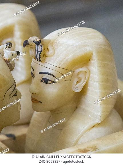 Egypt, Cairo, Egyptian Museum, Tutankhamon alabaster, from his tomb in Luxor, canopic box : The 4 human-headed jar lids wear the nemes, with snake and vulture