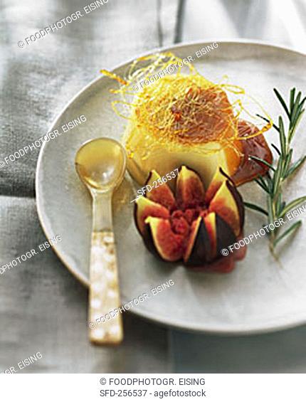 Rosemary panna cotta with caramel strands and fig
