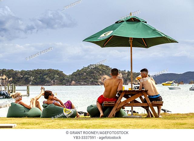 Visitors Relaxing At Otehei Bay, Urupukapuka Island, The Bay Of Islands, North Island, New Zealand