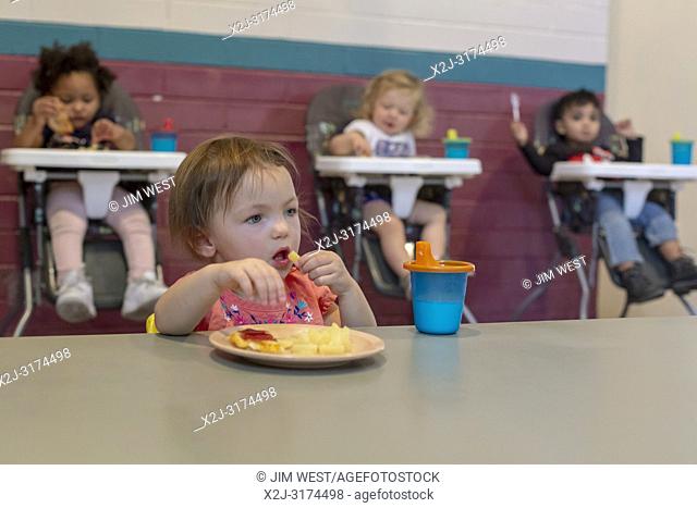 Alpine, Texas - Children eat lunch at the Alpine Community Center. The Center is a mission project of United Methodist Women