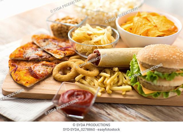 close up of fast food on wooden board