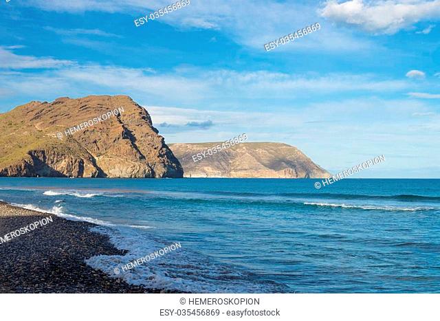 Las Negras beach with its dark volcanic rocks, Cabo de Gata, Andalusia, Spain
