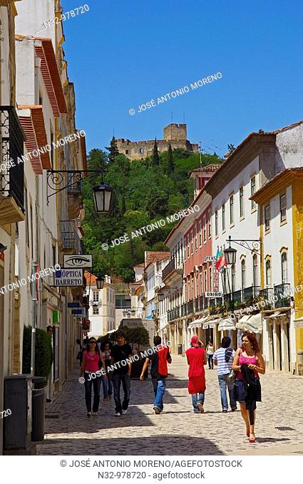 Rua Serpa Pinto street and Castle and Convent of the Order of Christ in background, Tomar, Santarem District, Ribatejo, Portugal