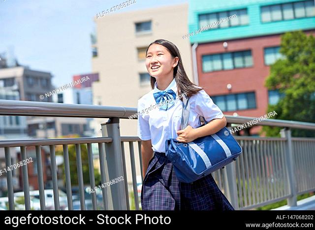 Happy Japanese junior high schoolgirl