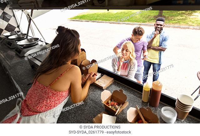 customers queue and saleswoman at food truck