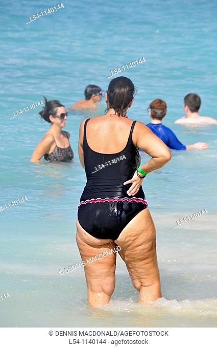 Overweight female at beach Grand Cayman Islands Caribbean
