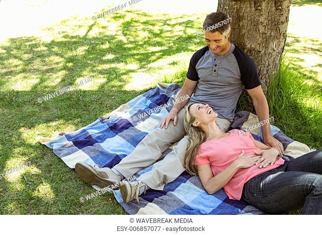 Happy couple relaxing in the park