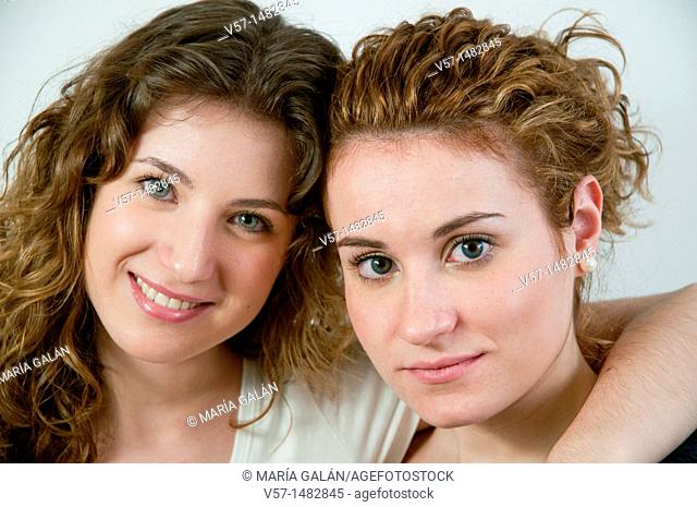 Portrait of two young women looking at the camera. Close view