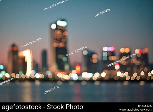 Bokeh lights of city buildings at night in Macau, China, Asia
