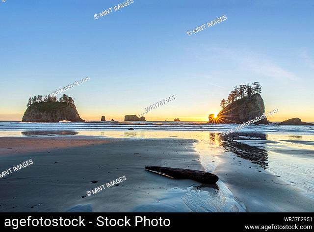Islands with trees off Second Beach at low tide at sunset