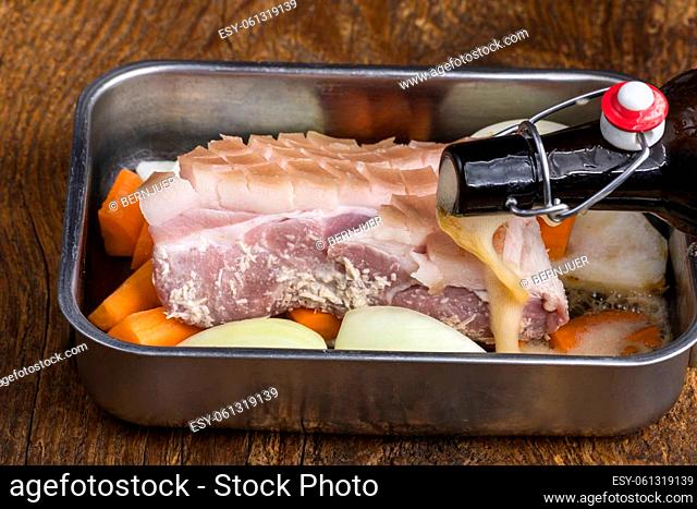 cut raw pork shoulder with vegetables