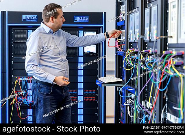 01 December 2022, Bavaria, Nuremberg: Christian Scheibe, research associate at the Chair of Electrical Energy Systems (LEES) at Friedrich-Alexander-Universität...