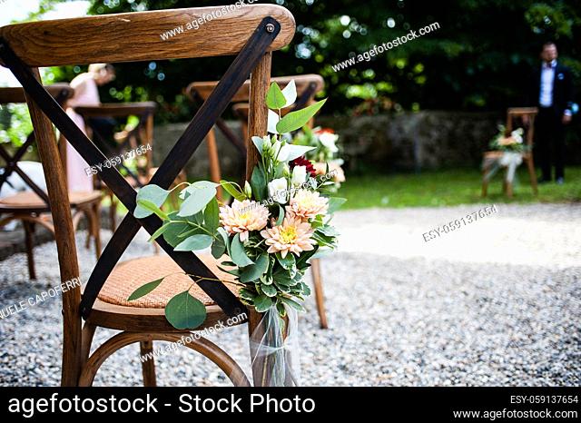 outdoor wedding chairs decorated with flowers