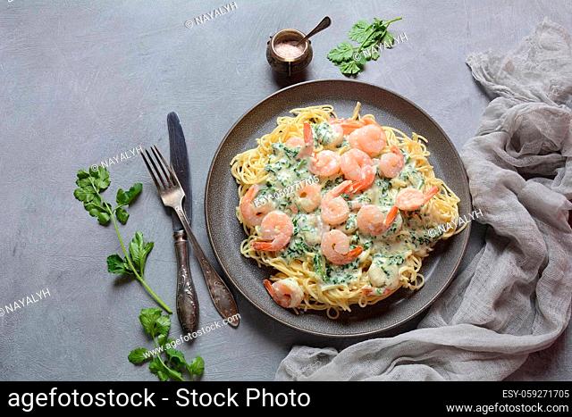 Italian Spaghetti or Pasta with shrimps, garlic and herbs in a creamy Alfredo sauce. Keto diet food concept