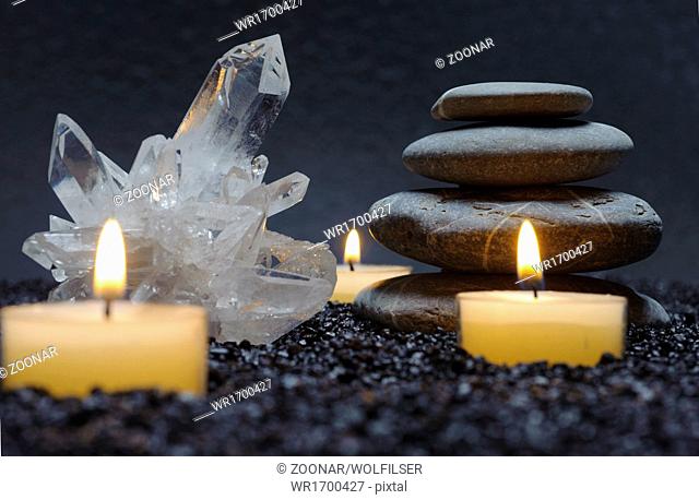 Japanese ZEN garden with black stones and candles