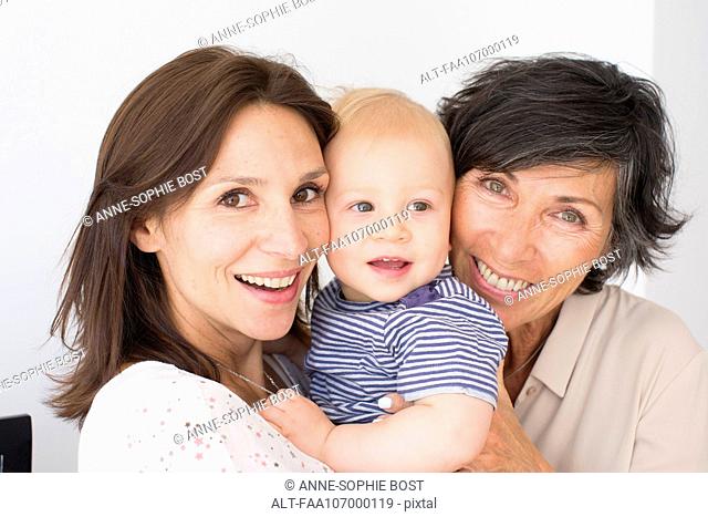 Smiling grandmother, mother and baby, portrait