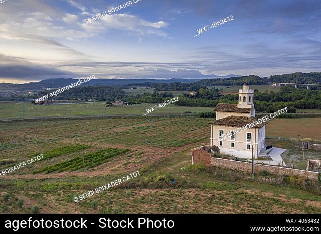 Torre LluviÃ  de Manresa, surrounded by vineyards of the DO Pla de Bages, in an aerial view of a summer sunrise (Barcelona province, Catalonia, Spain)