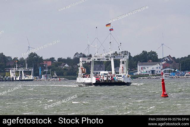 28 July 2020, Mecklenburg-Western Pomerania, Glewitz: The ferry ""Stahlbrode"" sails over the Strelasund off the island of Rügen