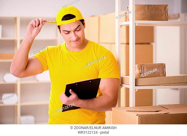 Man working in postal parcel delivery service office