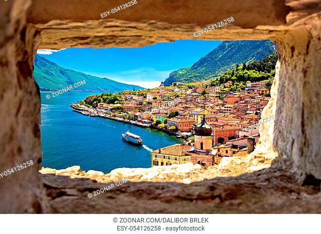 Limone sul Garda view through stone window from hill, Garda lake in Lombardy region of Italy