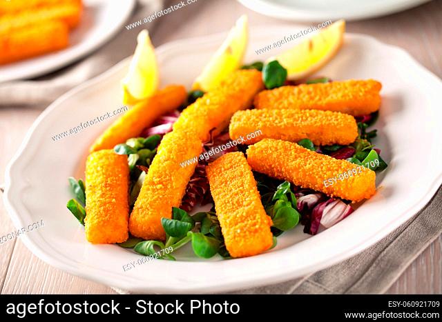Fresh breaded fish fingers served with mixed salad