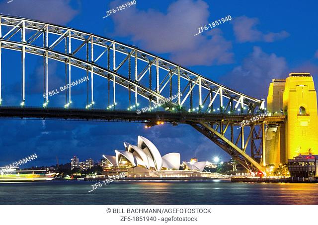 Twilight night exposure of color and great light of Famous Opera House and Harbour Bridge at skyline of Sydney Australia in New South Wales