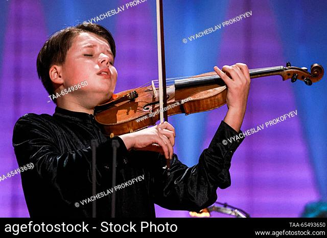 RUSSIA, MOSCOW - DECEMBER 5, 2023: Violinist Gleb Panov performs during the opening of the 24th Nutcracker International Television Contest for Young Musicians...