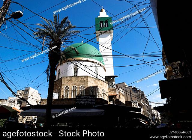 Tripoli, Lebanon: October 9 2015: Modern Mosque square minaret with power lines in Tripoli, Lebanon