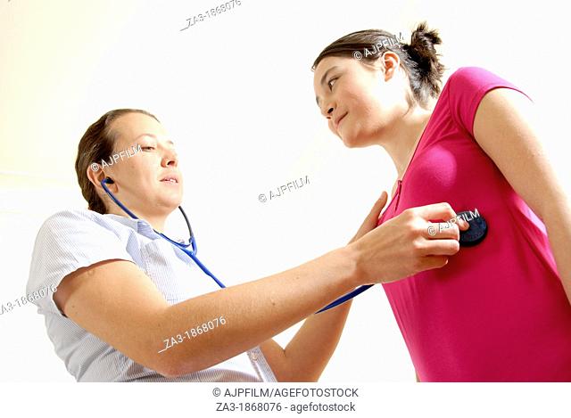 Stethoscope examination  General practitioner listening to a patient's breathing with a stethoscope