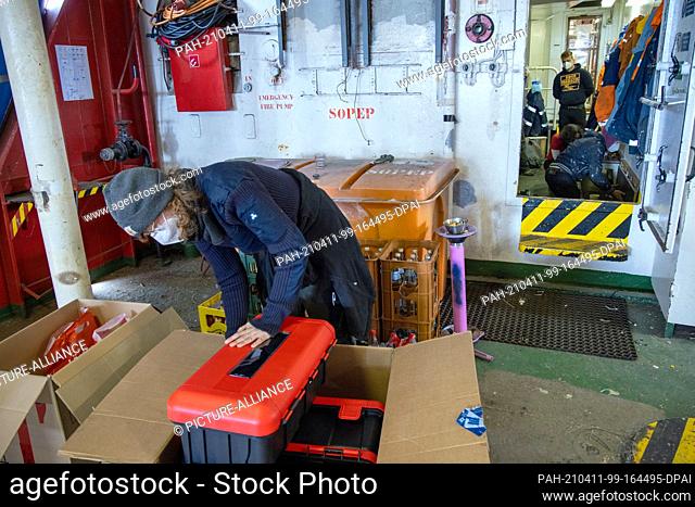 08 April 2021, Mecklenburg-Western Pomerania, Rostock: Crew members prepare the rescue ship ""Sea-Eye 4"" for deployment