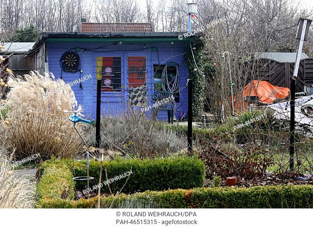 A woman's body cemented in concrete (under the orange tarp) in the allotment garden facility Hesselbach 1 + 2 in Essen, Germany, 20 February 2014