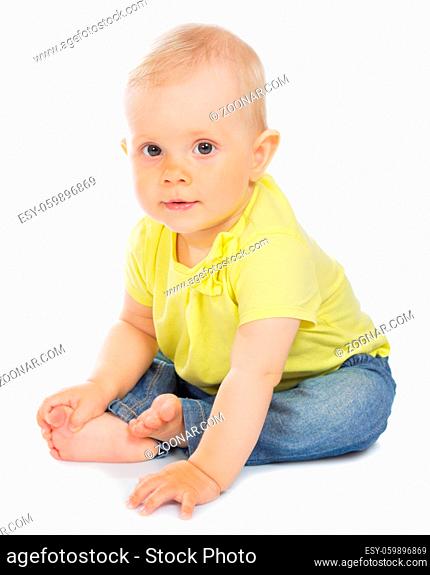 Little baby in blue jeans isolated