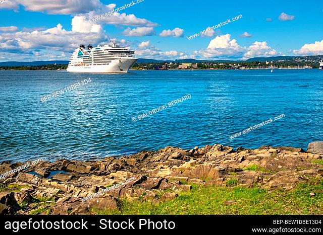 Oslo, Ostlandet / Norway - 2019/09/02: Panoramic view of Oslofjord harbor from Hovedoya island with MV Seabourn Ovation cruise ship by Seabourn Cruise Line in...