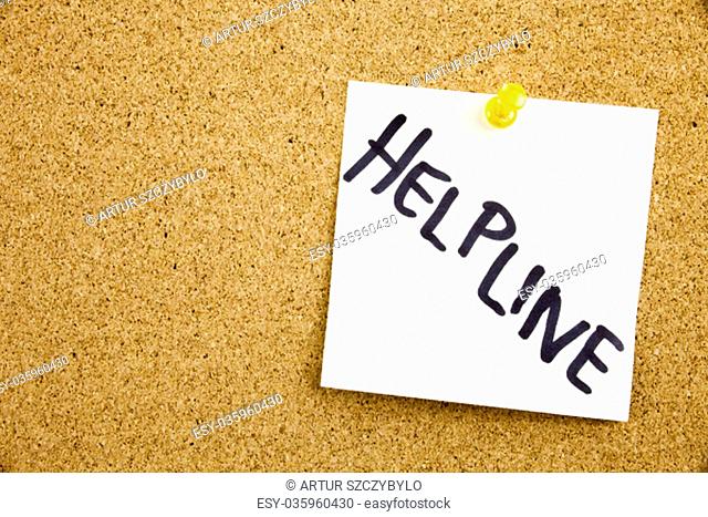 Phrase HELP LINE HELP LINE in black ext on a sticky note pinned to a cork notice board