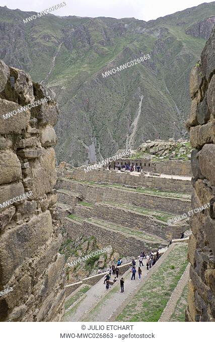 Tourists visit the ruins of the Inca archaeological site of Ollantaytambo near Cusco. Peru