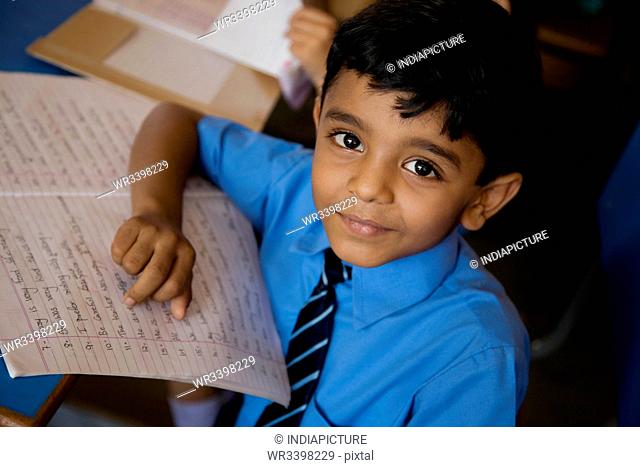School boy with his notebook
