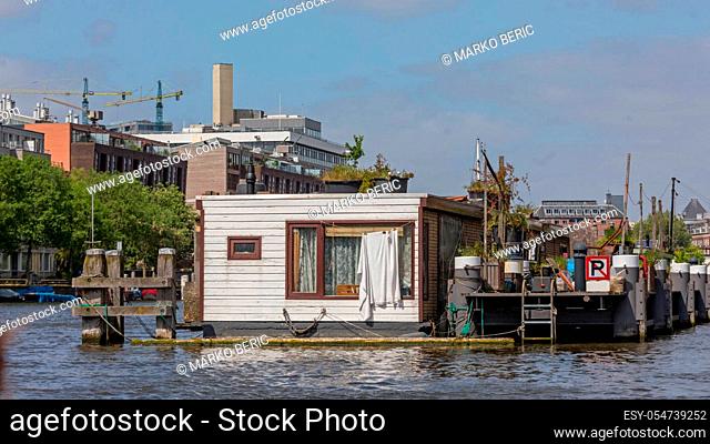 Houseboat Docked at Canal in Amsterdam Netherlands